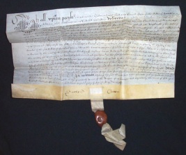 A vellum deed with seal tag dated 1638.