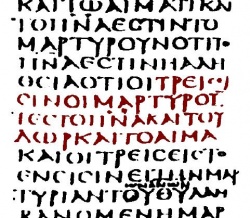 Excerpt from Codex Sinaiticus including 1 John 5:7–9. It lacks the Comma Johanneum. The purple-coloured text says: "There are three witness bearers, the Spirit and the water and the blood".