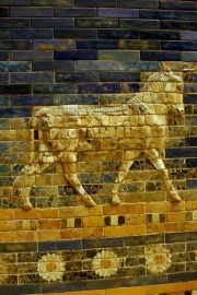 An aurochs above a flower ribbon; missing tiles are replaced